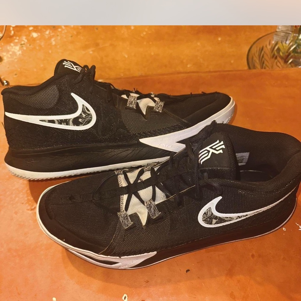 Nike Black Athletic Shoes with White Accents and Mesh Upper